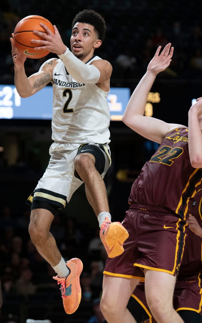 Vanderbilt Commodores guard Scotty Pippen Jr. (2) flies to the basket past Loyola Ramblers center Jacob Hutson (22) during the second half at Memorial Gymnasium Friday, Dec. 10, 2021 in Nashville, Tennessee.